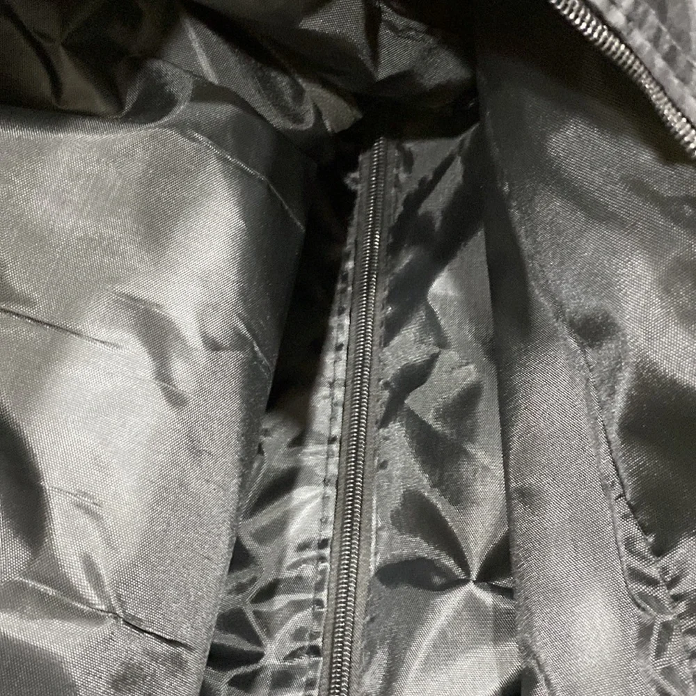 NWOT. Nylon rolling carry-on bag.